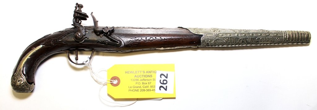 FLINTLOCK PISTOL: EARLY FLINTLOCK PISTOL EMBOSSED BARREL, CARVED WOOD - SILVER DECOR, GOOD CONDITION MISSING BUTT CAP