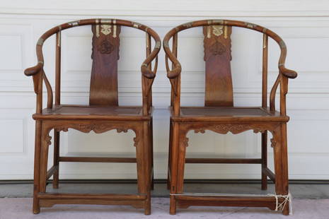 A pair of Huanghuali horse shoe chairs by Wu, Bing Liang, late 20th century: A pair of Huanghuali horse shoe chairs by Wu, Bing Liang, late 20th century. Height: 99.00cm, seat height: 49.00cm, depth: 57.00cm, width: 46.00cm.