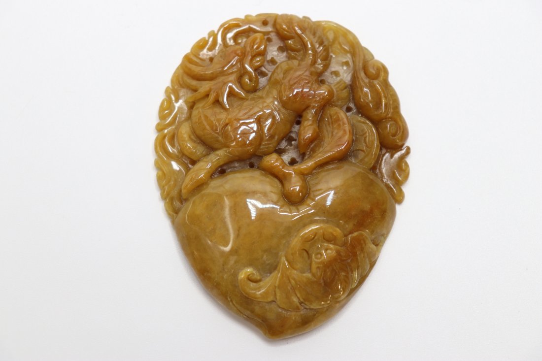 An antique yellow jadeite pendant with Qilin, Bat and Peach design (1 of 6)