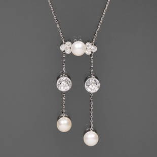 ANTIQUE J.E. CALDWELL NATURAL PEARL & DIAMOND NECKLACE: Philadelphia, PA Late 19th century; designed as central plaque mounting a natural button pearl flanked by six .20 ct full cut diamonds, the plaque suspending two chains - each with a single ~1.5 ct