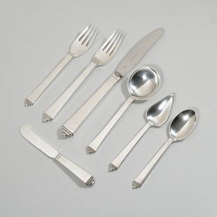 GEORG JENSEN PYRAMID PATTERN STERLING SILVER FLATWARE: Service for twelve (12) comprising; 12 dinner forks (7.25 in.), 12 dinner knives, 12 salad forks, 12 cream soup spoons, 12 teaspoons, 12 grapefruit spoons, and 12 flat handled butter spreaders; No