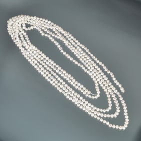 VERY LONG STRAND OF BAROQUE PEARLS