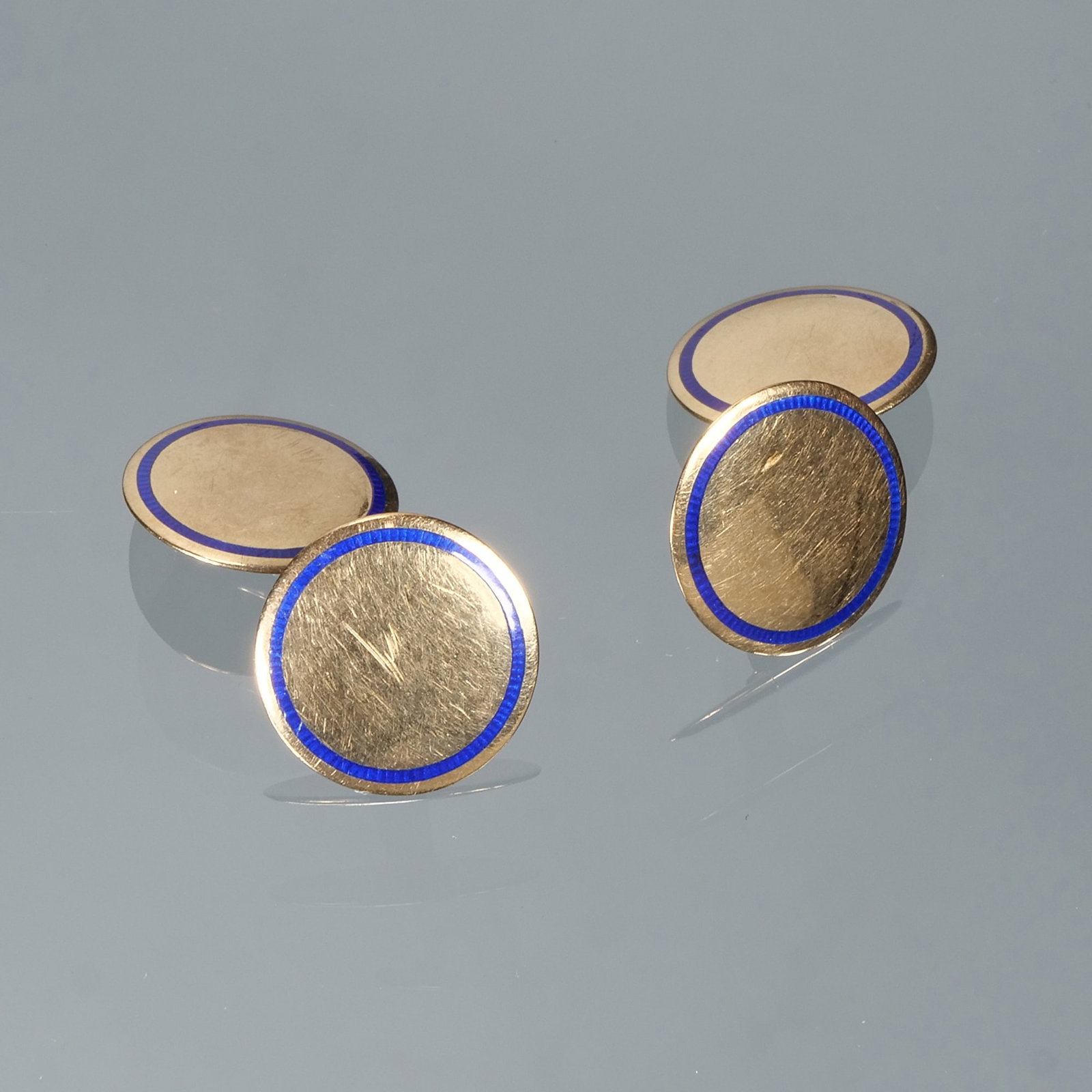 PAIR BLUE ENAMEL & 14K GOLD CUFFLINKS: Designed as polish round gold cufflinks each set with a border of blue enamel; 3/8 in. 9.1g total weight; marked "14" Provenance: Descended through the family of a Somers, NY lady. Inventory Code 3S-4