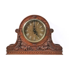 ORNATELY CARVED MANTEL CLOCK