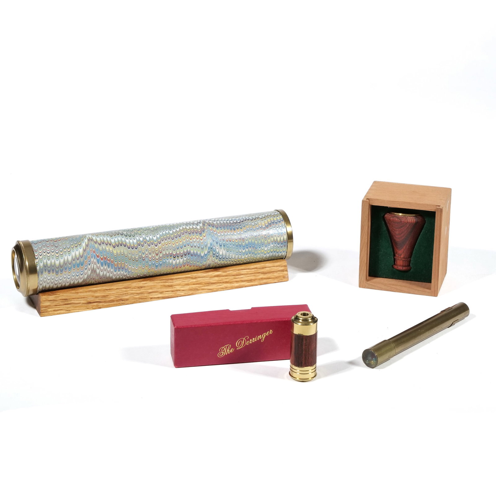 (4pc) VAN CORT KALEIDOSCOPES: Including The Derringer and The Dragonfly, each in their original box, plus a small brass pen-form kaleidoscope and a paper-wrapped "L'Optique" kaleidoscope - l. 10 x dia. 2 in. (largest) Provenance: