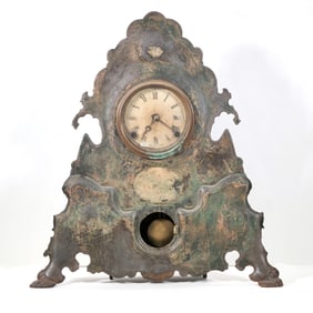 UNUSAL CAST IRON SHELF CLOCK