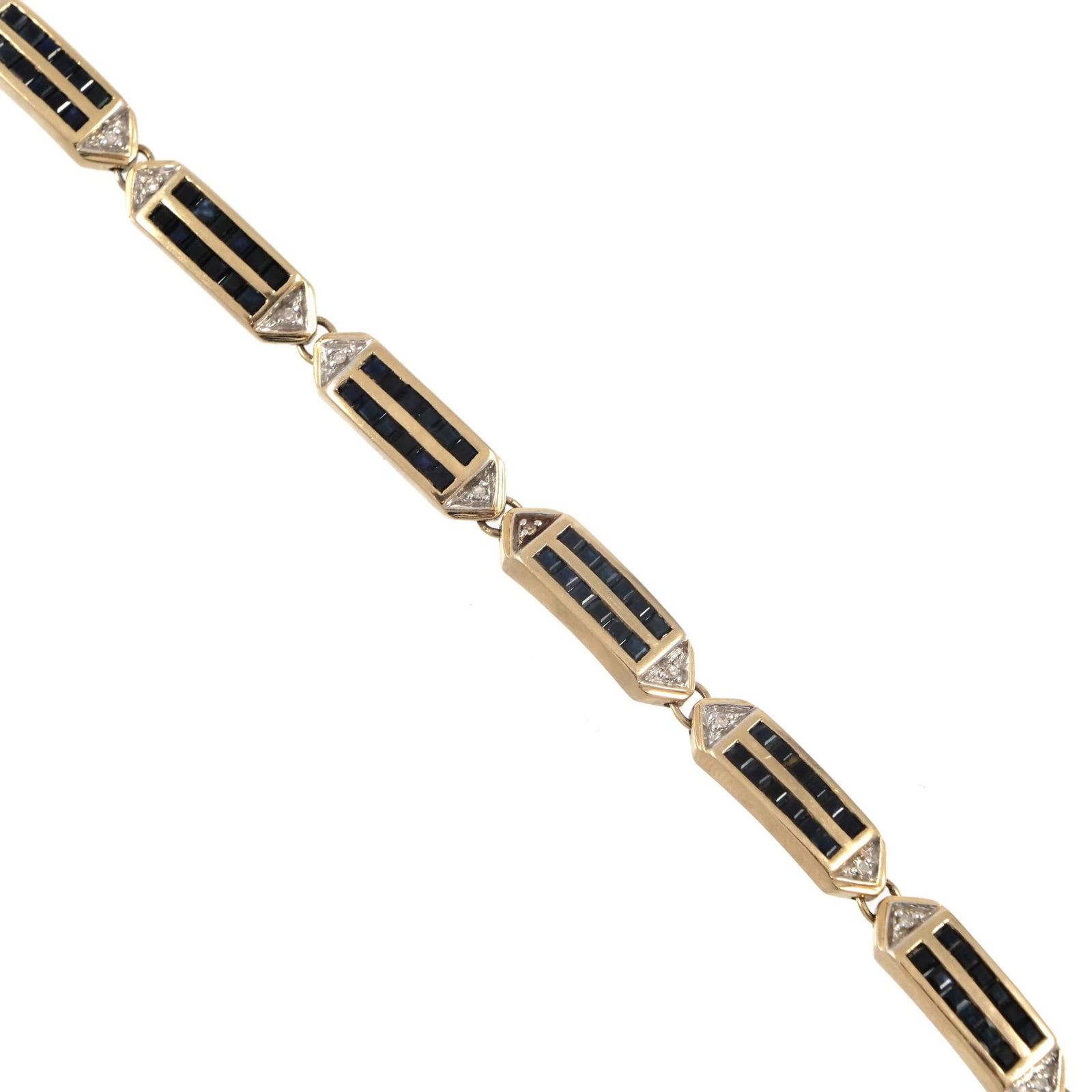 SAPPHIRE, DIAMOND, & 14K YELLOW GOLD LINK BRACELET: Flexible gold bracelet, each station with two rows of channel set sapphires (or other blue stones) and flanked by a single melee diamond on each end, with 14k fineness mark to box clasp; 16g l. 7 in.
