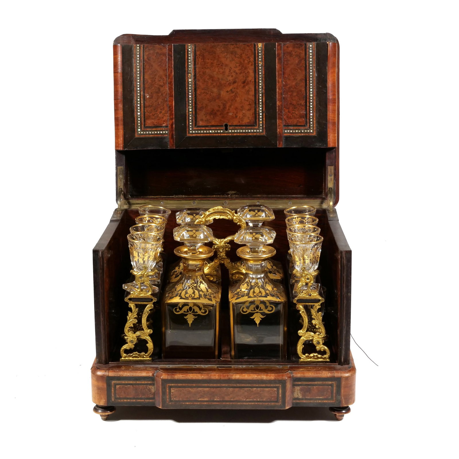 19TH C. FRENCH MARQUETRY LIQUOR CELLAR: Tantalus box, having four crystal decanters and a set of cordial glasses with hand painted gilt decor in fitted interior, with intricate inlay details, designed with a hinged lid and sides that open -