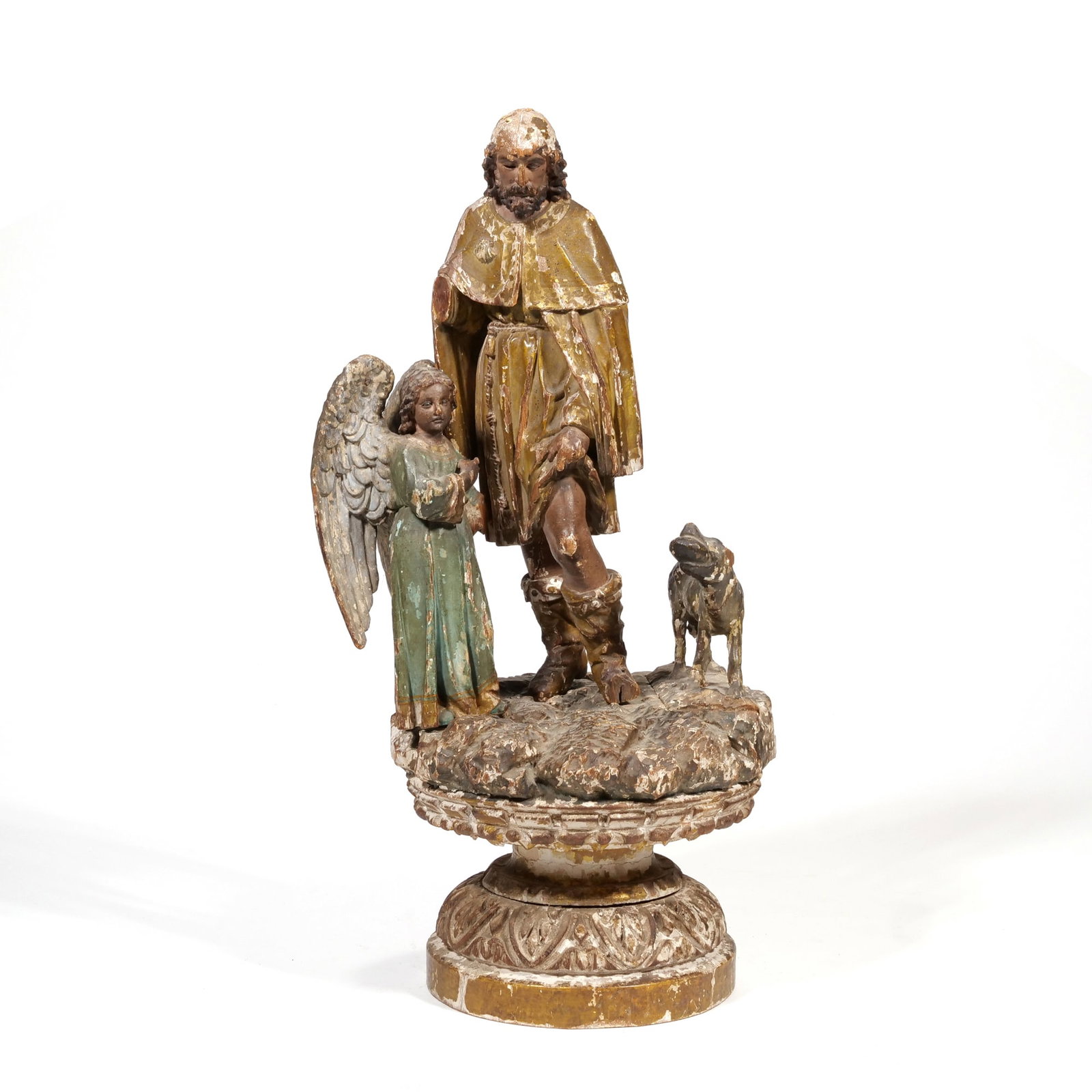 CONTINENTAL SCHOOL (18TH CENTURY) POLYCHROME RELIGIOUS CARVING, ST. ROCH: Saint Roch with Angel and Dog Polychrome carved wood Sculpture rendered in carved wood with polychrome and gilt finishes, depicting Saint Roch displaying a wound on his thigh. He is flanked by a winge