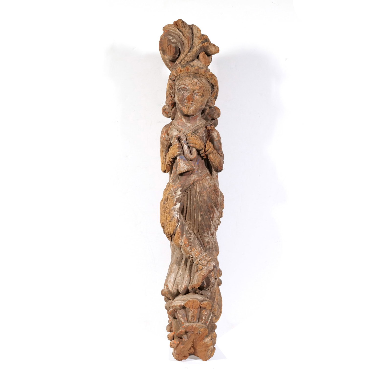 INDIAN SCHOOL (19TH CENTURY) CARVED WOOD SCULPTURE: Architectural Fragment Carved wood with polychrome h. 23.5 x w. 4.5 x d. 7 in. Hand-carved high relief figure depicting a celestial dancer with traces of original red, blue, and white pigment. - h. 23