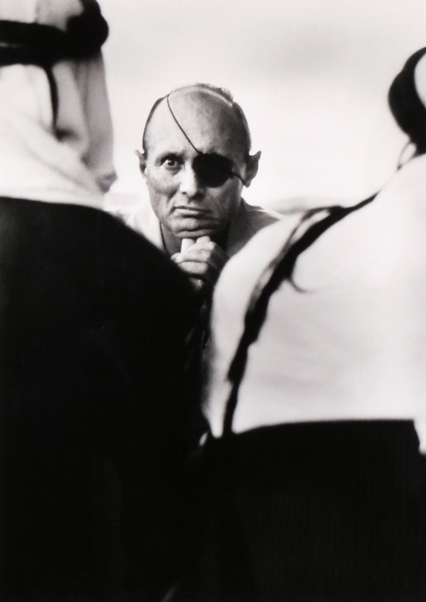MICHA BAR-AM (ISRAELI, B. 1930) PHOTOGRAPH: Moshe Dayan, Suez Canal Gelatin silver print h. 21.25 x w. 15.25 in., sight This black and white portrait depicts Moshe Dayan looking forward with his hand to his chin, positioned between two figures 
