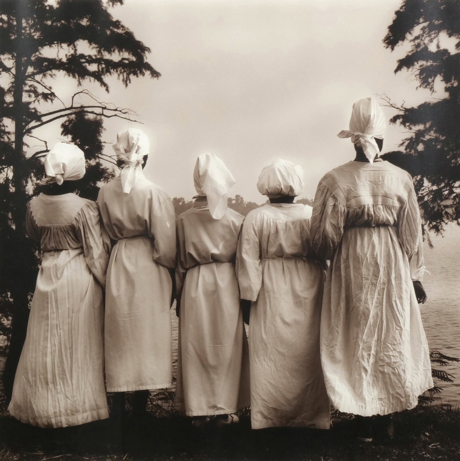 JACK SPENCER (AMERICAN, B. 1948) TONED SILVER GELATIN PHOTOGRAPH: Baptismal Candidates, Moon Lake, MS Toned silver gelatin photograph 18.25 x 18.25 in., sight Signed in pencil lower right and numbered 13/50 lower left. This work is housed in a black wood frame with 