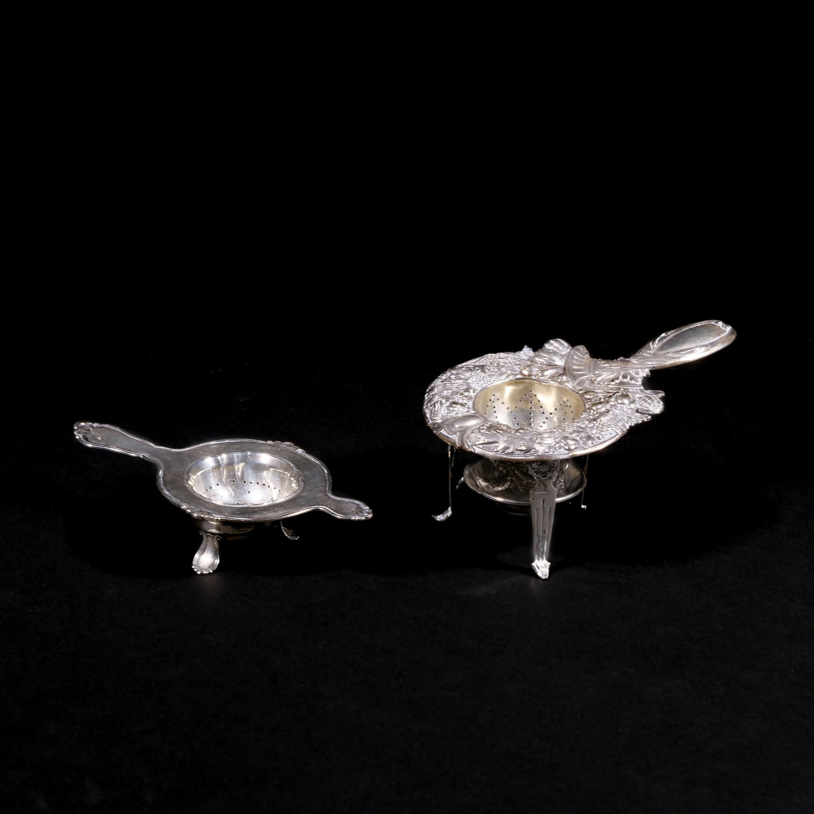 (4pc) SILVER TEA STRAINERS: Including an early 20th C. Danish silver tea strainer, marked on back with three towers (Copenhagen city mark) and '29' to indicate the year, plus 'CFH' mark to indicate the assayer, Christian F. Heis