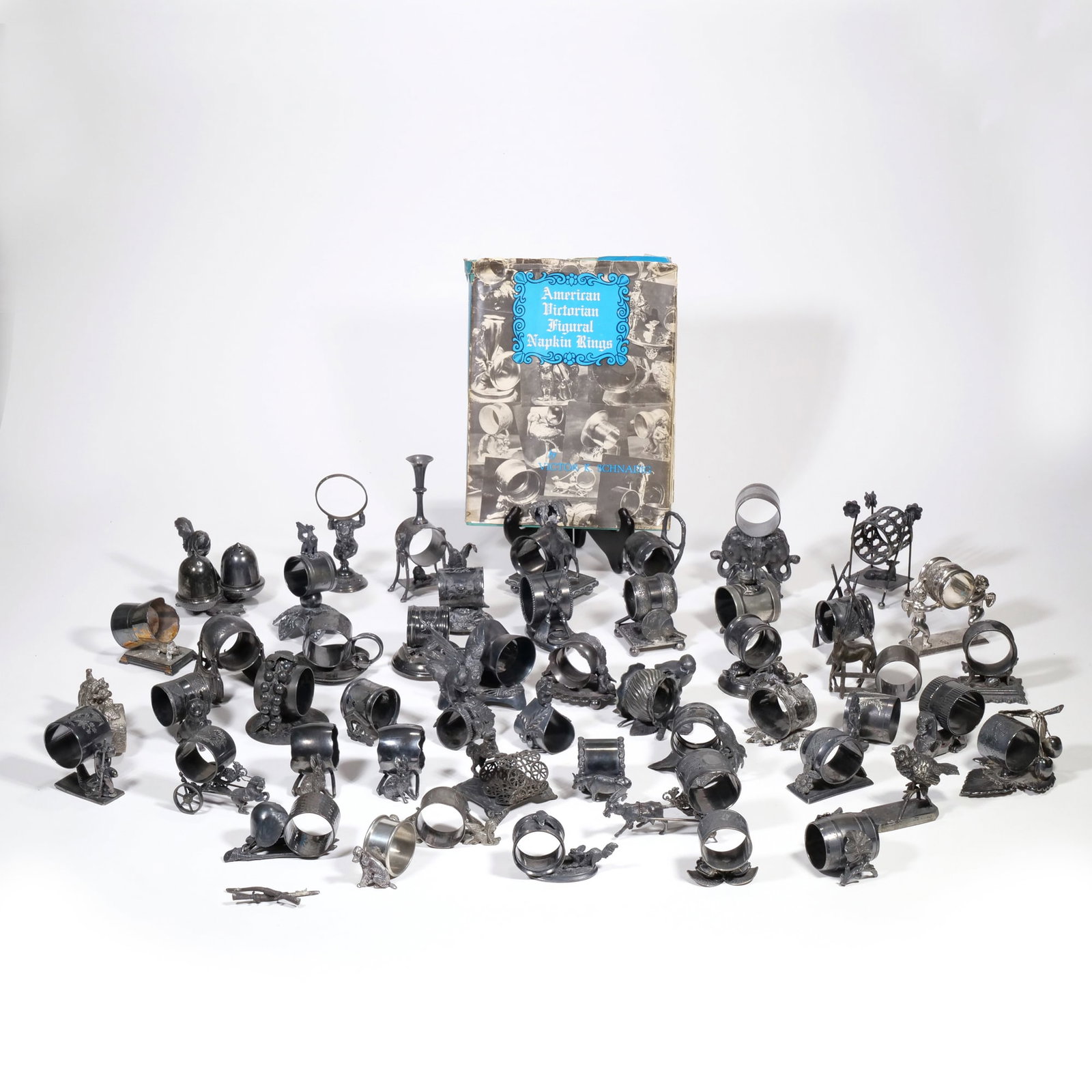 COLLECTION OF AMERICAN VICTORIAN FIGURAL NAPKIN RINGS (1 of 20)