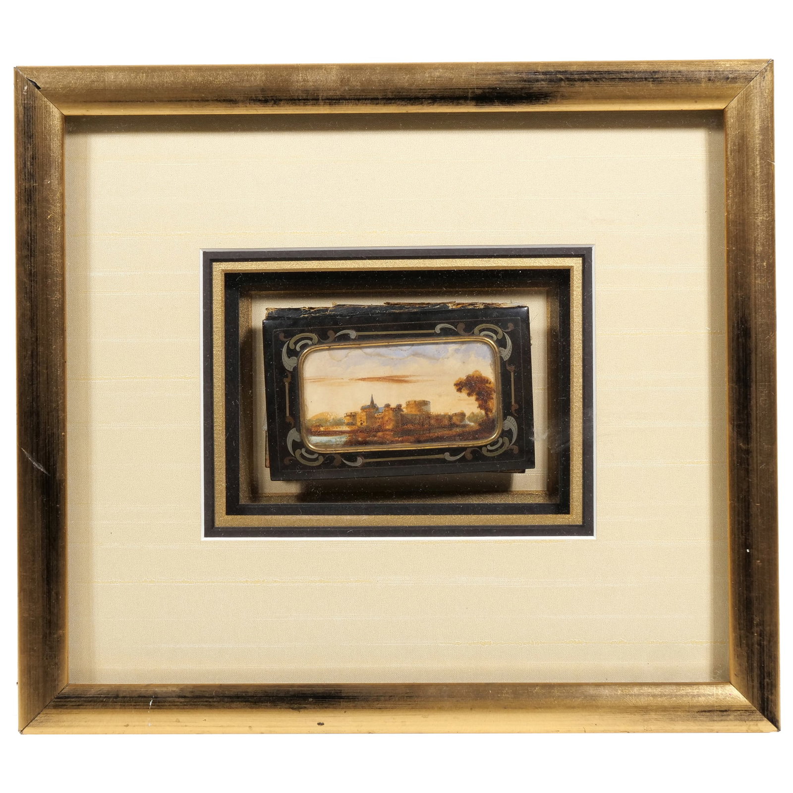 EUROPEAN SCHOOL (19TH CENTURY) PAINTED AIDE-M?MOIRE: Grand Tour Riverside Castle Scene Watercolor on Aide-M?moire [pocket notebook] cover h. 9.75 x w. 11 in., frame; h. 2.5 x w. 3.75 in., book Features a central landscape vignette on the cover with