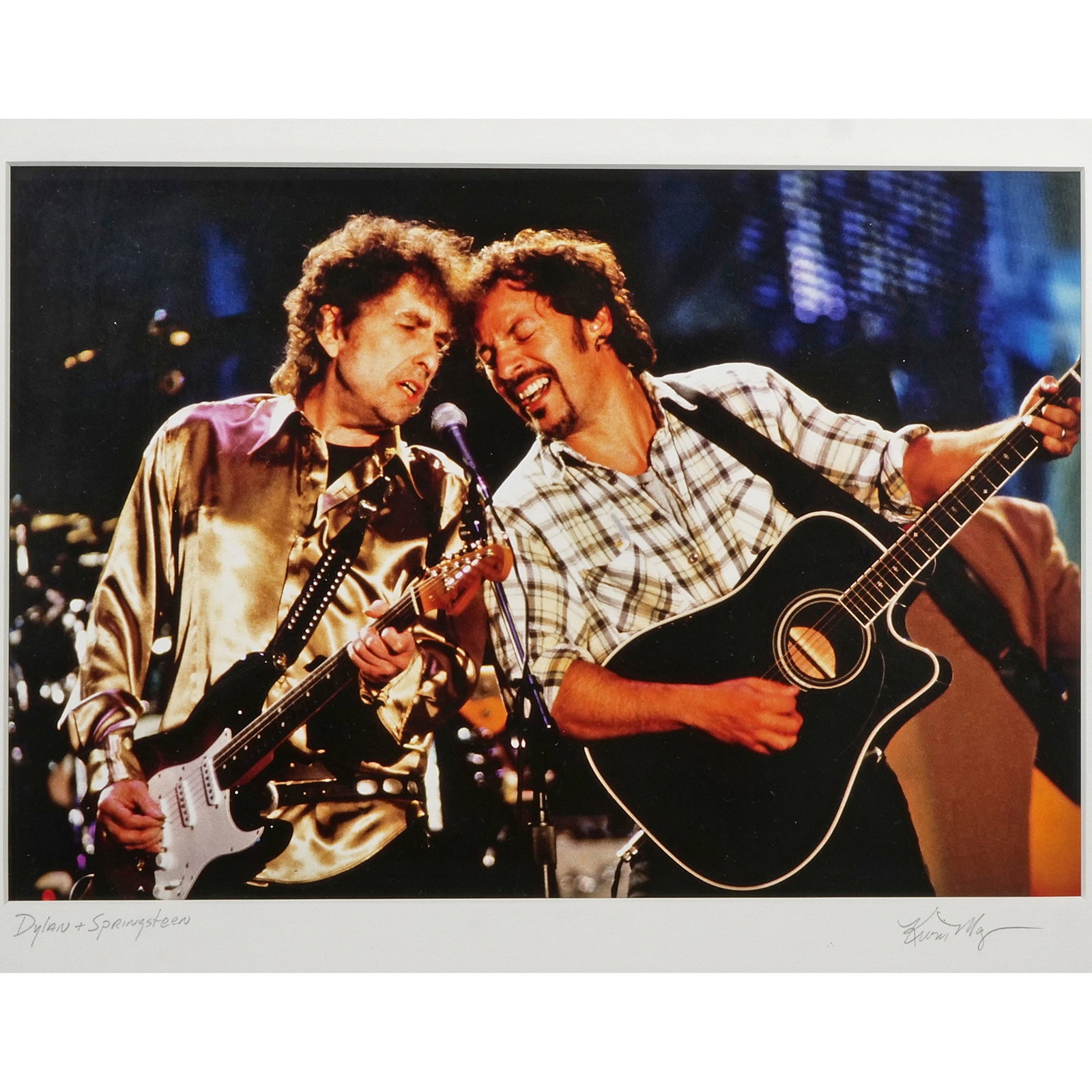 BOB DYLAN & BRUCE SPRINGSTEEN PHOTOGRAPH: Photograph print of Bob Dylan & Bruce Springsteen performing at the Rock & Roll Hall of Fame's Grand Opening Concert, signed by photographer Kevin Mazur 8.75 x 12.75 in. Sight - h. 19 x w. 23 x d. 2 i