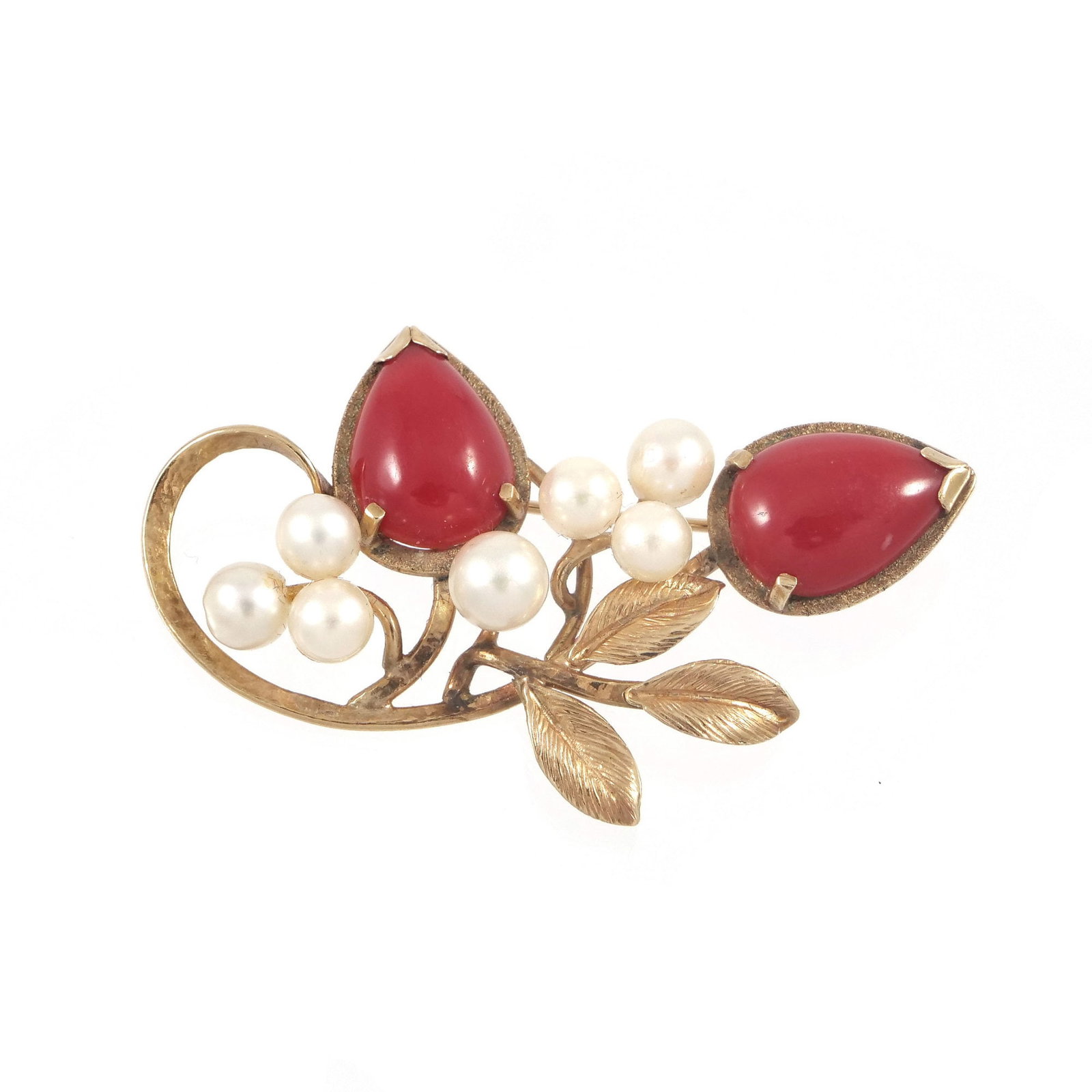 CORAL, PEARL, & 14K GOLD BROOCH: Floral form pin set with two pear-shaped coral cabochons, seven round pearls, and having three gold leaves, with 14k fineness mark to back; 8.0g - w. 2 in. (approx.) Inventory No. 93-32 Provenance: It