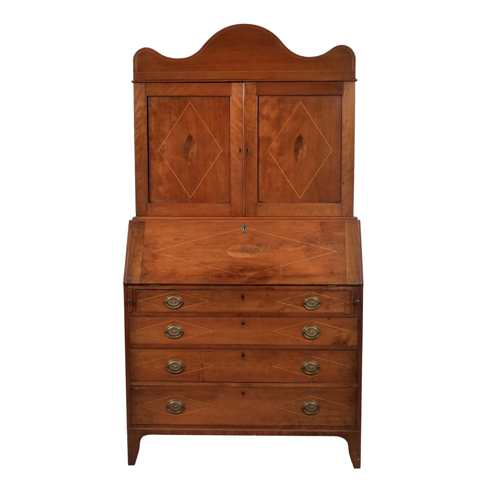 FEDERAL-STYLE INLAID MAHOGANY SECRETARY BOOKCASE: Mahogany secretary bookcase having a shaped crest over two cupboard doors with diamond-motif string inlay. The slant-front desk opens to reveal a fitted interior with small drawers and pigeon hole cub