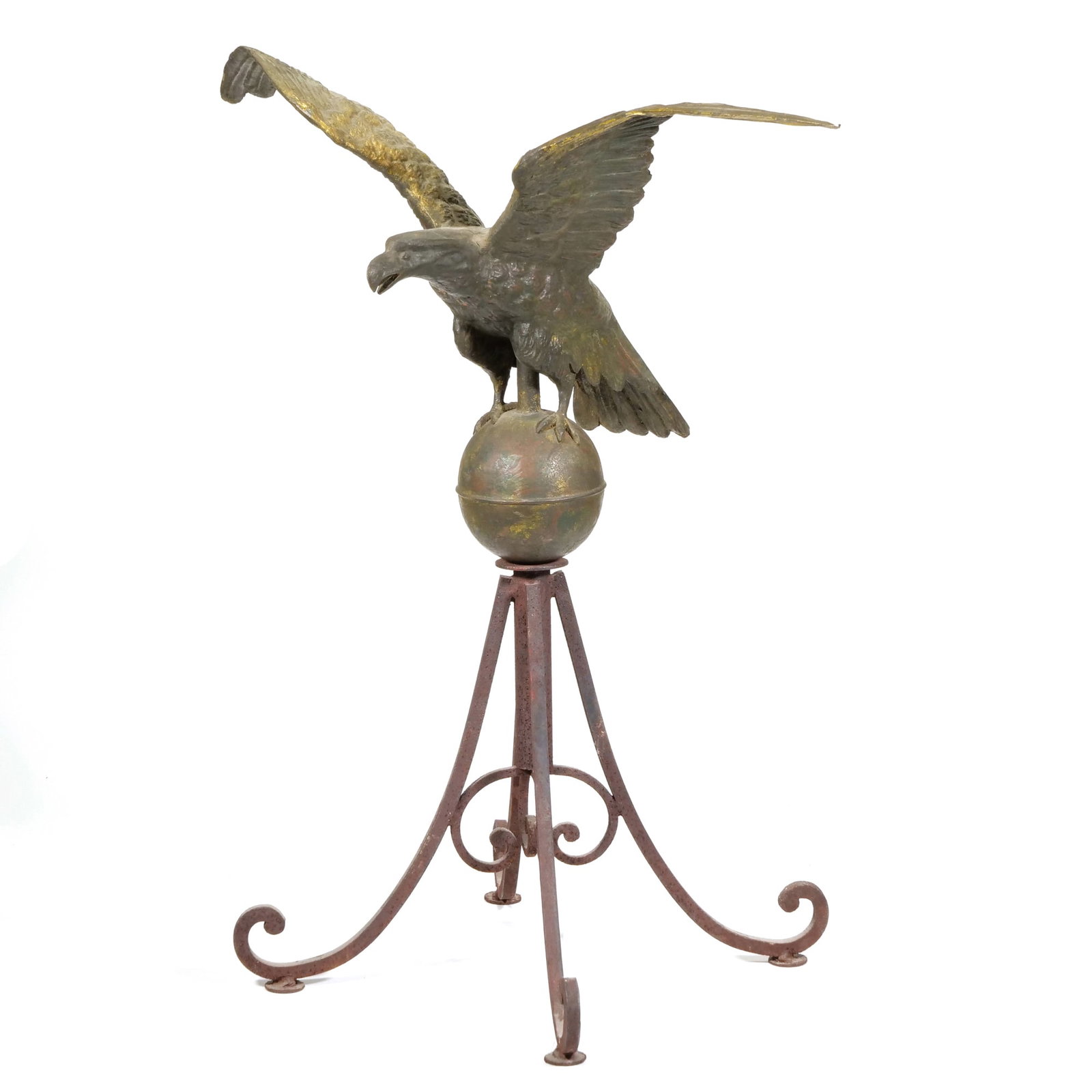 AMERICAN FOLK ART (19TH C.) EAGLE WEATHERVANE: Eagle Weathervane Molded copper and wrought iron h. 32 x w. 25 x d. 17 in., overall The eagle features outspread wings and perches on a copper sphere above a scrolled wrought iron quadruped base. The 
