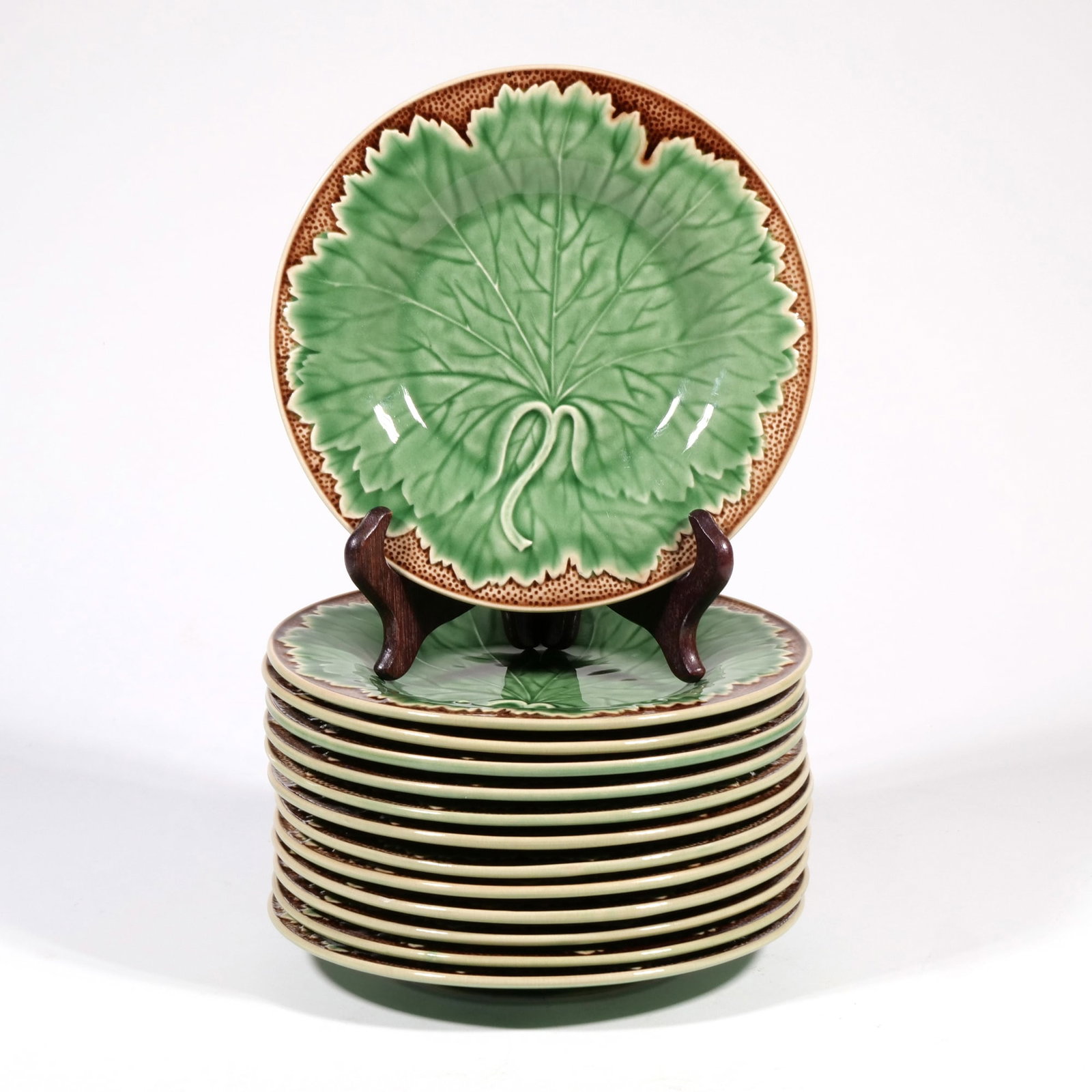 (13pc) FRENCH & PORTUGUESE CABBAGE PLATES: Some with 'Eigin, Paris, France' mark to bottom, the others with 'J. Willfred, Made in Portugal' mark to base - dia. 7.875 in. Inventory No. 1AA-25 Provenance: From a stately Greenwich, CT home