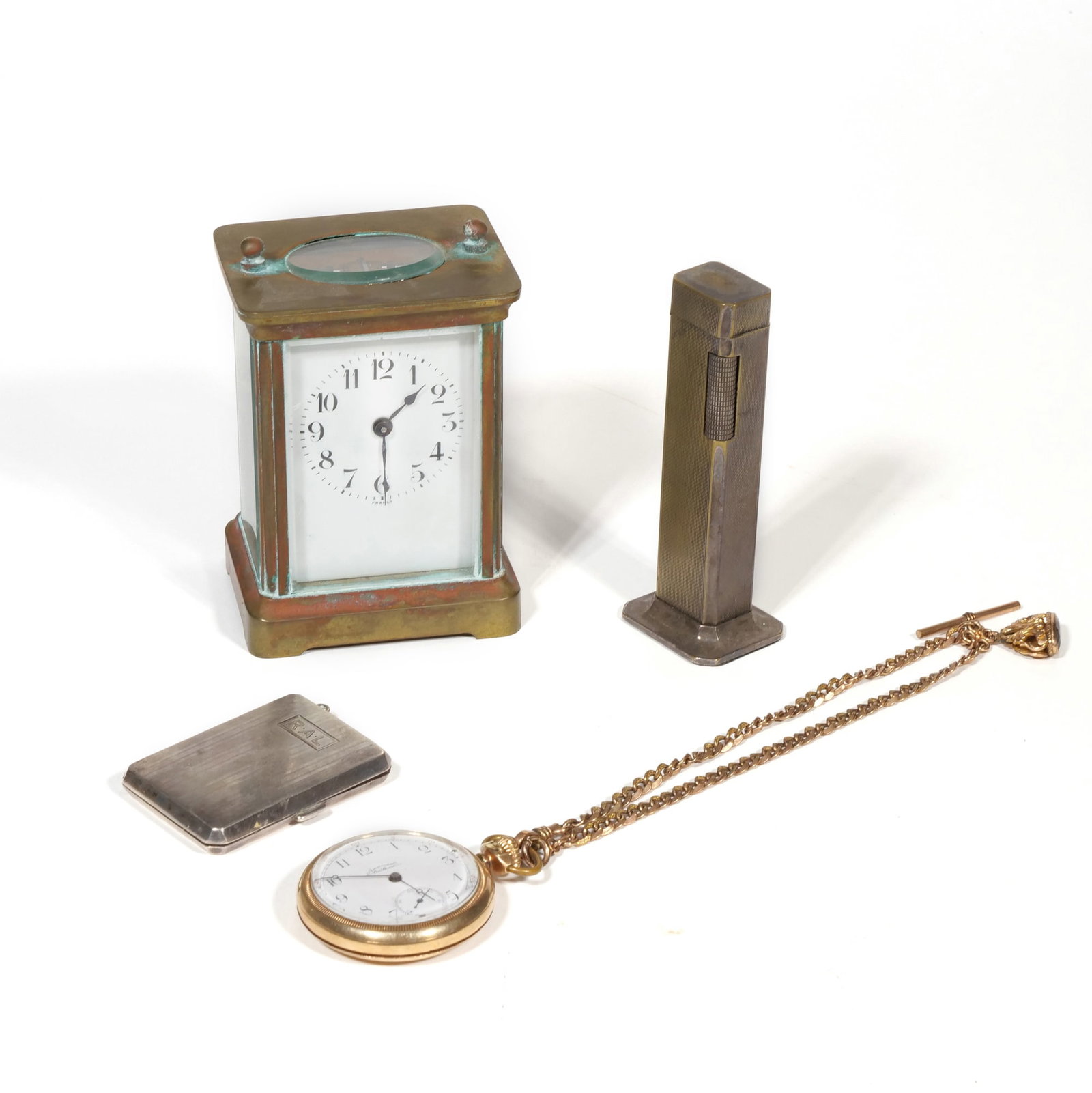 (4pc) GROUP OF TABLE ITEMS & ACCESSORIES: Including a sterling silver compact with fineness mark inside (1.27 ozt, with 'R.A.L." monogram to front), an Antique French brass carriage clock with Arabic numerals (h. 4.25 in.), an English Dunhill