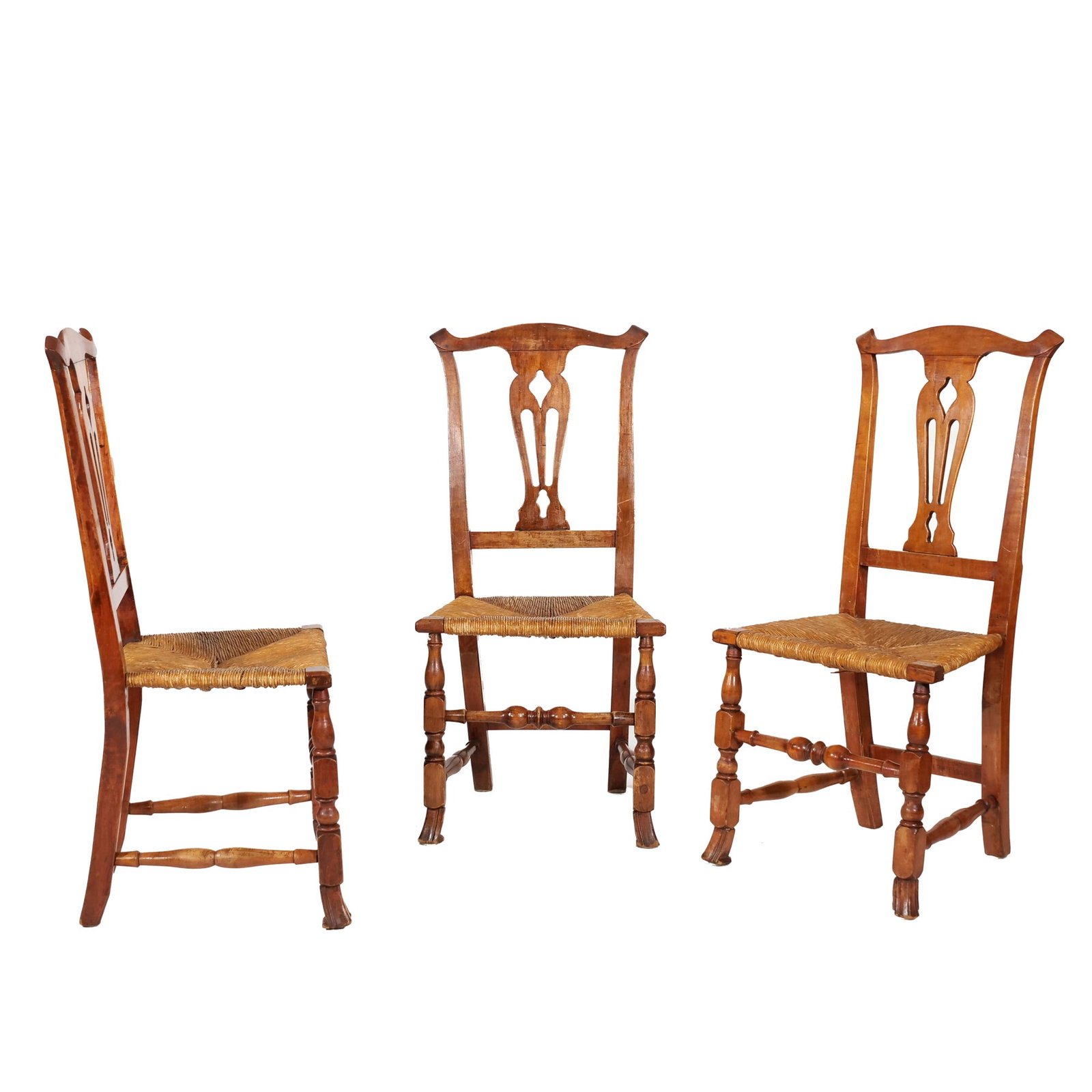 (3pc) ANTIQUE CHAIRS WITH SPANISH FEET AND RUSH SEATS: Including three wooden William and Mary style side chairs featuring woven rush seats and carved Spanish feet,&nbsp; with a shaped crest rail above a pierced decorative splat and turned front legs 