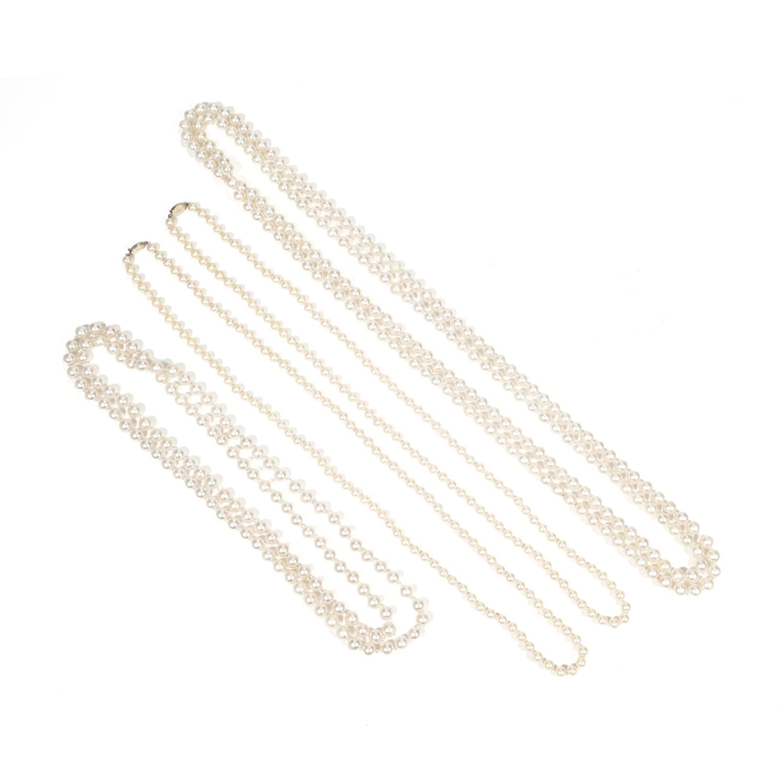 (4pc) GROUP OF FAUX PEARL NECKLACES: Including an endless strand of knotted, round faux pearls (l. 84 in.), another endless strand of knotted, round faux pearls (l. 54 in.), plus a pair of knotted, round faux pearl necklaces each with a 