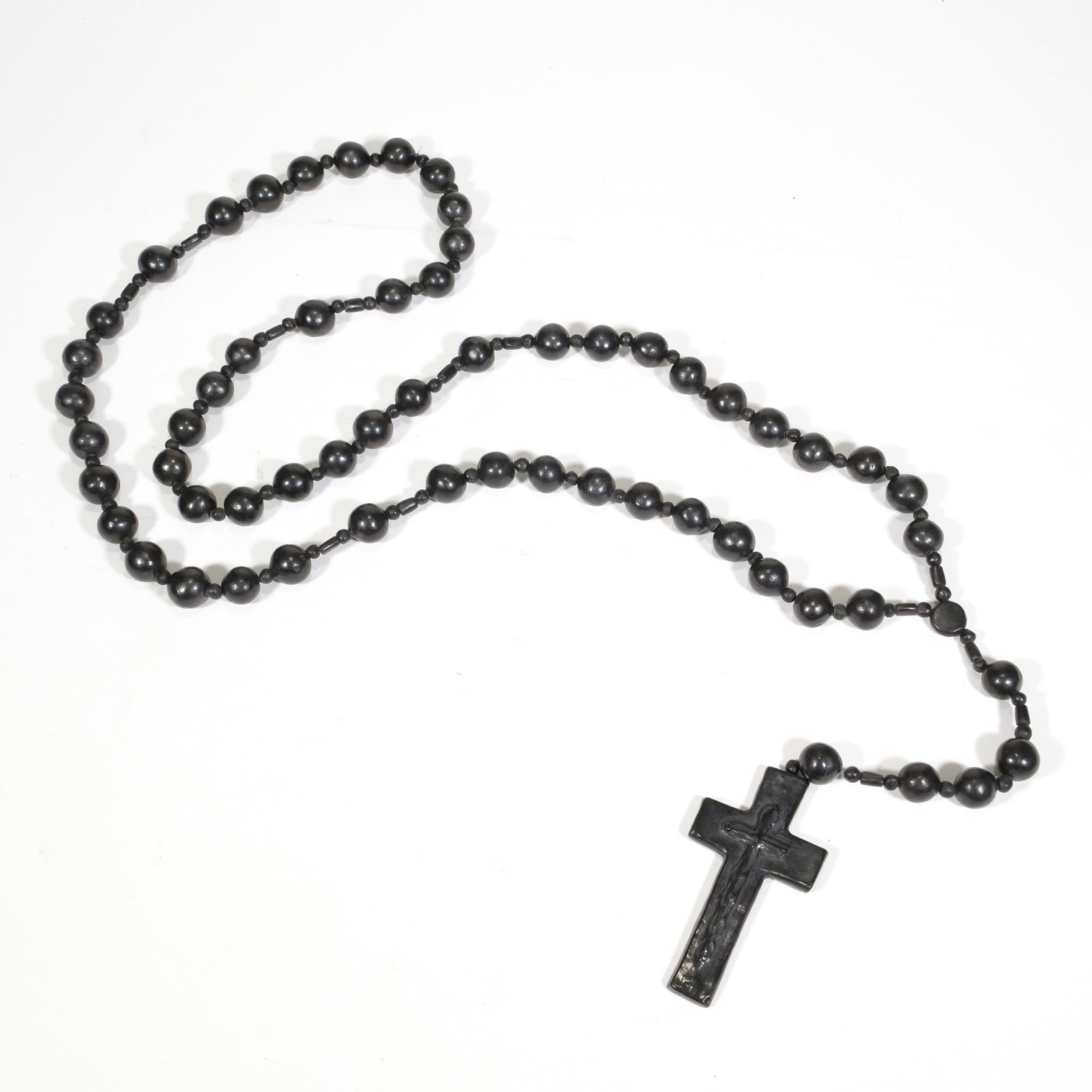 LARGE WALL-HANGING ROSARY BEADS: A large rosary-style strand of beads suspending a cross (5 x 2.75 in.) - l. 47 in. (approx.) Inventory No. 64-172 Provenance: Property from The Private Collection of Edmund and Leslie Glass, Manhattan