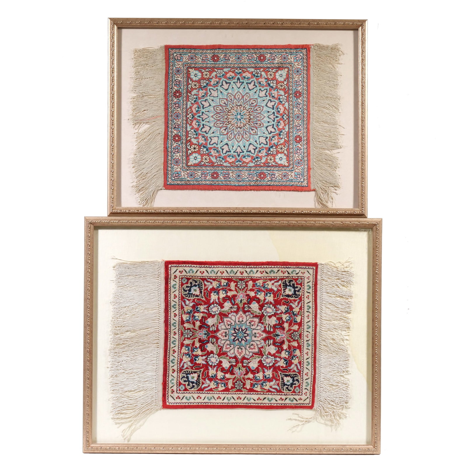 (2pc) FRAMED MINIATURE RUGS: Hand woven needlepoint mini dollhouse rugs designed in the Persian style, each with a central colorful medallion and white fringe at two ends; 19 x 12 in. (larger rug only, over fringe), 17 x 12 in.