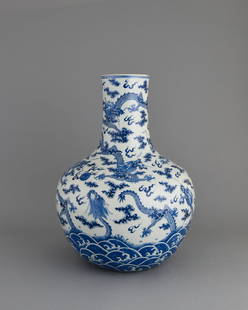 Chinese blue and white Tianqiu Ping: A Chinese blue and white porcelain vase decorated with nine imperial dragons (five-clawed) in nine different appearances identical to the stone carvings on the hillside outside the Forbidden City in B