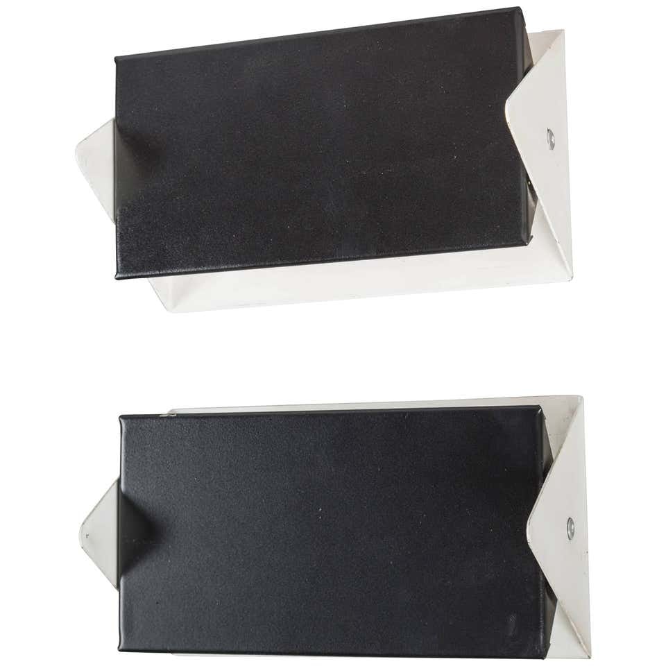 Pair of 1950s J.J.M. Hoogervorst Black and White Wall Lights for Anvia: Quantity: 2 lamps Pair of 1950s J.J.M. Hoogervorst black and white wall lights for Anvia. Executed in white and black painted metal, the shade can be angled for direct/indirect lighting. Retains origi