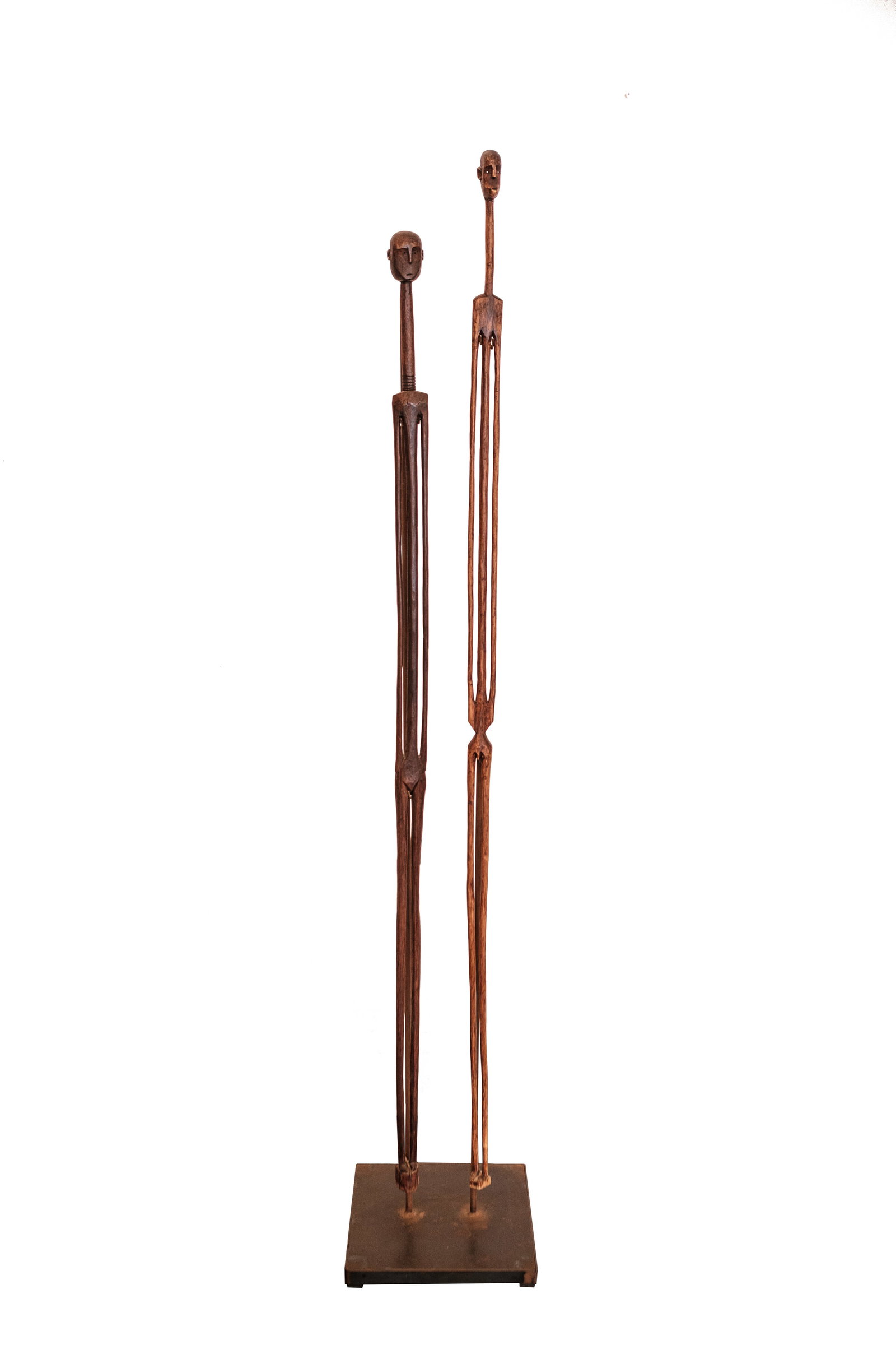 Large Vintage Carved Wood 'Man & Woman' Figural African Folk Sculpture: Quantity: 1 Large vintage carved wood 'Man & Woman' figural African Folk sculpture. An expressive pair of human figures exquisitely handcrafted from richly colored wood and mounted independently on a