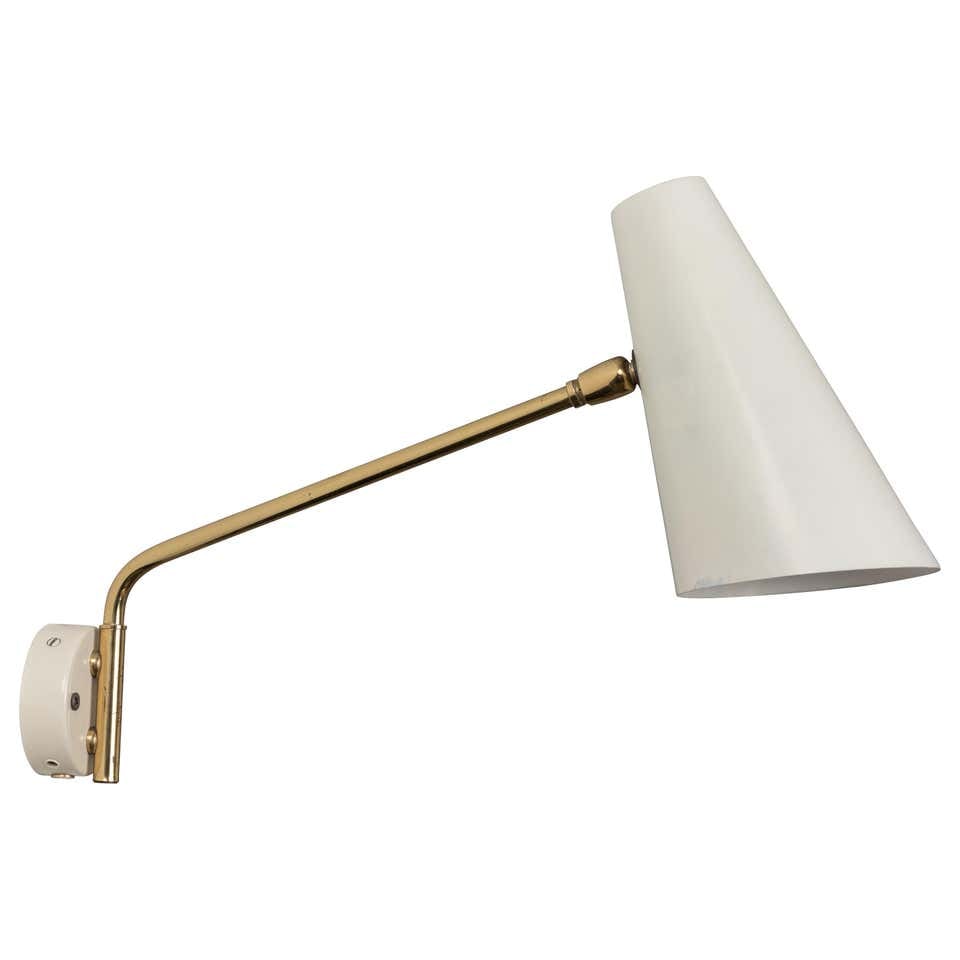 1960s Cosack Leuchten Articulating Wall Light: Quantity: 1 1960s Cosack Leuchten articulating wall light. Executed in white enameled metal and brass in the manner highly reminiscent of Paavo Tynell's 9459 wall lights.