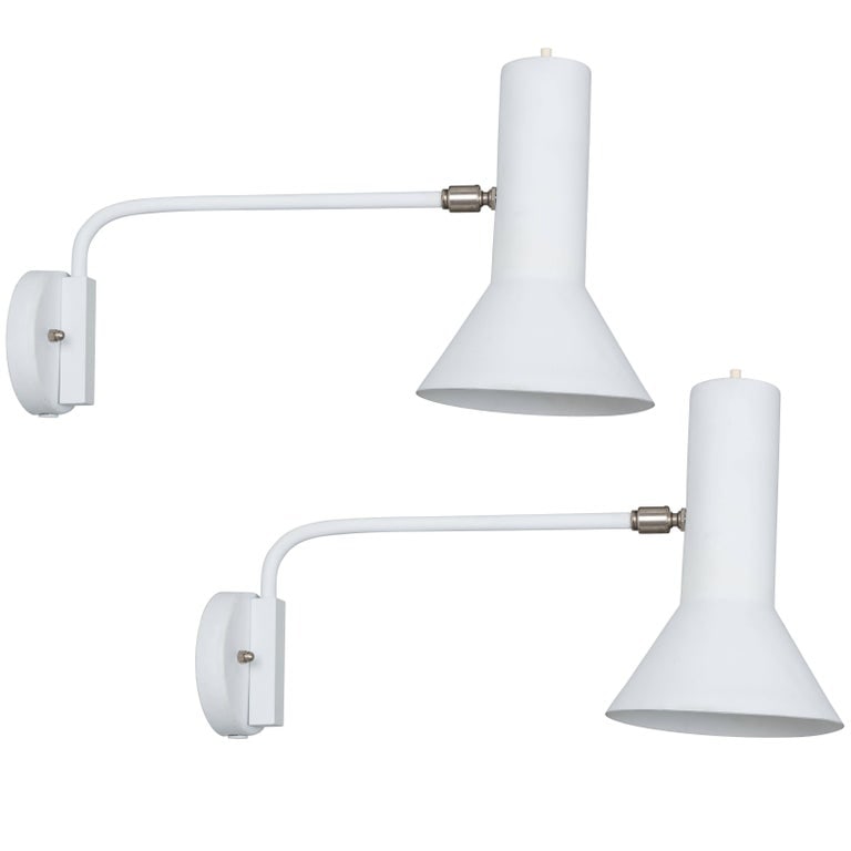 Pair of J.J.M. Hoogervorst Swivel-Arm Wall Lights for Anvia, 1960s: Quantity: 2 Pair of J.J.M. Hoogervorst swivel-arm wall lights for Anvia, 1960s. Executed in white painted metal, the arm swings from side to side and the shade adjusts on a swiveling ball joint for ma