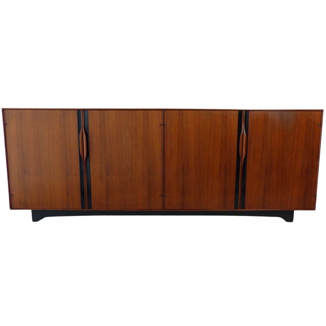 Glenn of California John Kapel Credenza: Quantity: 1 Four door credenza with sculpted walnut handles that open to shelves and drawers. Beautiful black accents on the doors and base make the walnut pop. Designed by John Kapel for Glenn of Cal