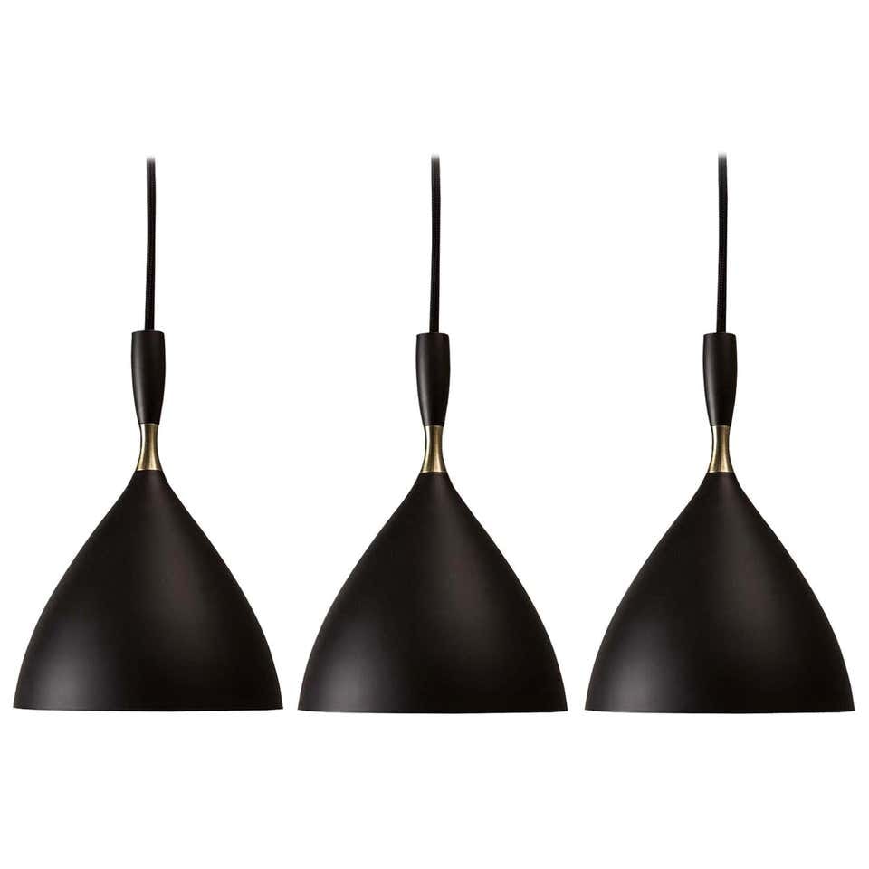 Set of 3 Birger Dahl Pendants in the Style of Stilnovo Black: Quantity: 3 lamps Set of 3 Birger Dahl pendants in the style of Stilnovo by Northern Lighting. Executed in black enameled metal with exquisite brass detail. 36" custom black cloth cord and brass ceili