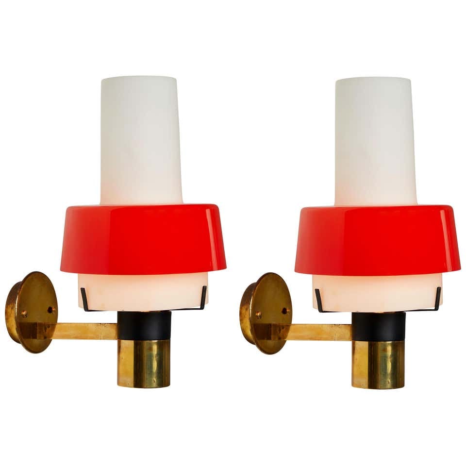Pair of 1950s Stilnovo Model 2079/1 Brass and Glass Sconces with Original Labels: Quantity: 2 lamps Pair of 1950s Stilnovo Model 2079/1 brass and glass sconces with original labels. Executed in brass, thick opaline glass, red Perspex and retains original Stilnovo label. Stilnovo wa
