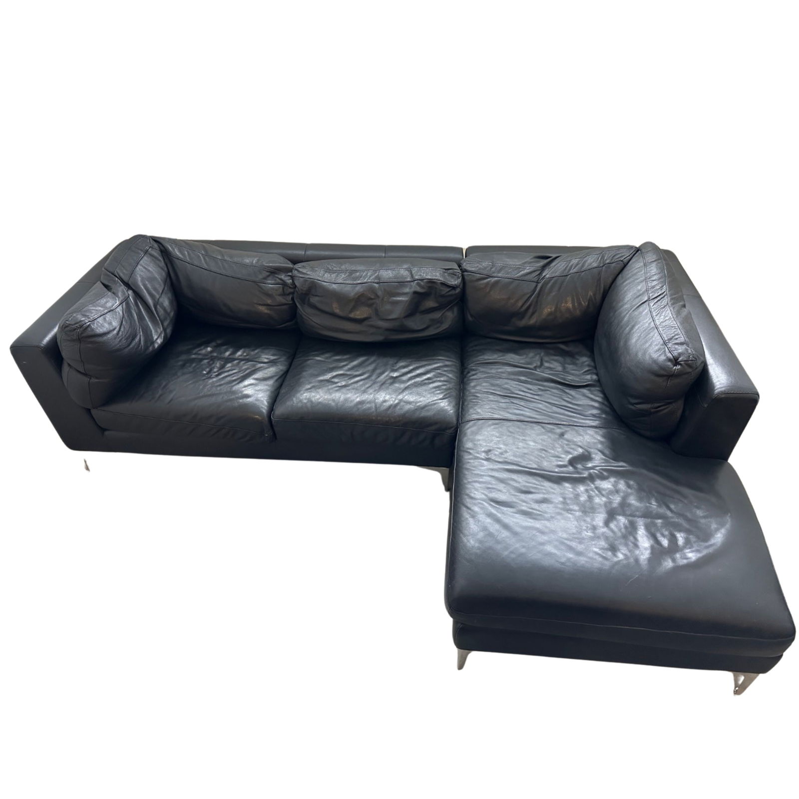 2010s Design Within Reach Black Leather Nicoletti Albert Sectional: Quantity: 1 Originally designed by Giuseppe Nicoletti for Design Within Reach in 2010. Produced in Italy. The sectional features a two seat sofa piece and a chaise in black tumbled leather upholstery