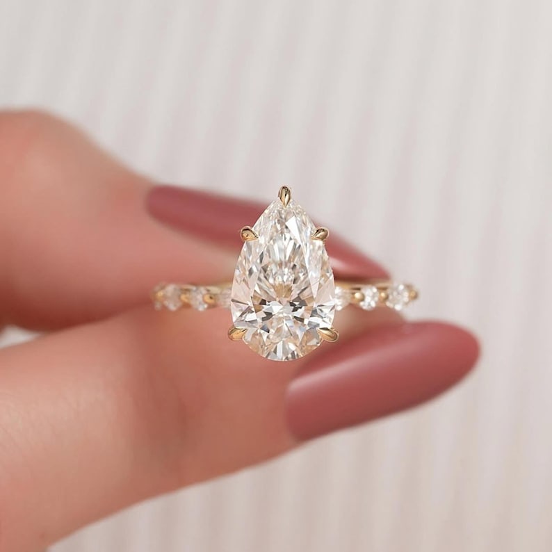 Certified 3 Carat Pear Cut Lab Grown Diamond D VVS1 Color 14kt Solid Yellow Gold Engagement Ring: Certified 3 Carat Pear Cut Lab Grown Diamond D VVS1 Color 14kt Solid Yellow Gold Engagement Ring - Side Stone Lab Grown Diamonds 0.50 Ct Round Cut VS1 E Color - Ring Size US 7