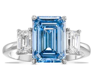 4.00 Carat Emerald Cut Certified Lab Grown Blue Diamond Ring in 14KT Solid White Gold: 4.00 Carat Emerald Cut Certified Lab Grown VS1 Blue Diamond Ring in 14KT Solid White Gold ) Total Carat Weight is - 5.40 Ct ( 1.40 Ct Emerald Cut Lab Grown Diamonds Side Stones (VS1, E Color) – Exce