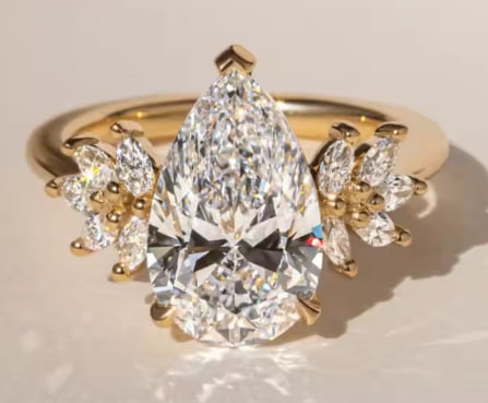 Certified 10 Carat Pear Cut Lab Grown Diamond 14kt Solid Yellow Gold Engagement Ring: Certified 10 Carat Pear Cut Lab Grown Diamond 14kt Solid Yellow Gold Engagement Ring - D Color VS1 Pear Cut- Side Diamonds is Marquise Cut 0.60 Ct - Ring Size US