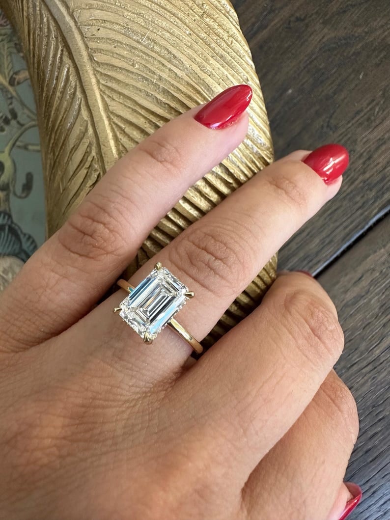 Certified 3 Carat 14KT Solid Yellow Gold Lab Grown Diamond Emerald Cut Engagement Ring: Certified 3 Carat 14KT Solid Yellow Gold D Color VVS1 Lab Grown Diamond Emerald Cut Engagement Ring - Side Stone is Lab Grwon Diamond Round Cut 0.20 ct - Ring Size US 7