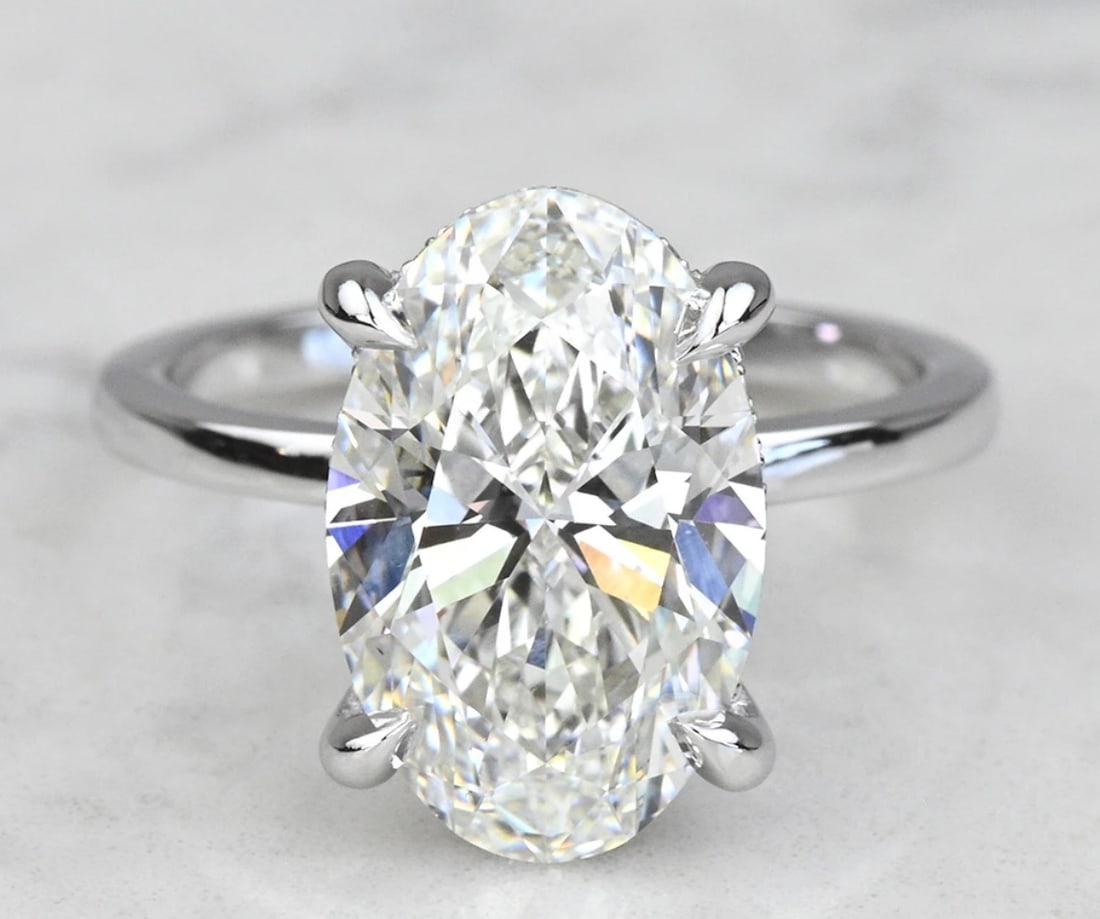 Certified - 6.10 Carat - 14Kt Solid White Gold - Lab grown diamond Ring D Color VVS1 Oval Cut: Certified - 6.10 Carat - 14Kt Solid White Gold - Lab grown diamond Ring D Color VVS1 Oval Cut - Side Stone is 0.30 ct vvs1 e color round cut - ring size US 7- Ring Resize Available free of Cost,--Free