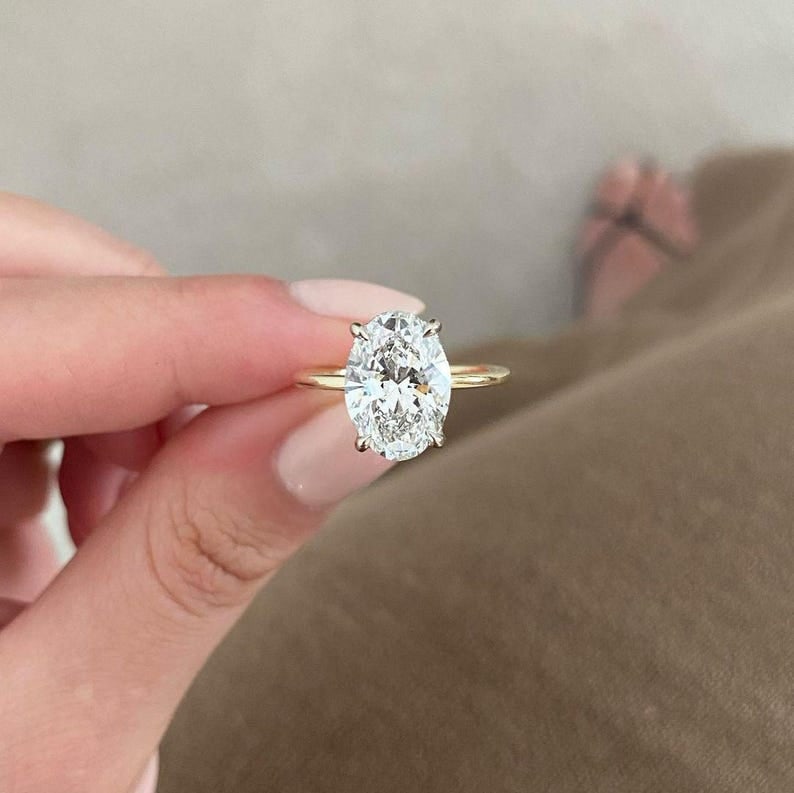 Certified 2.20 Carat Oval Cut Lab Grown Diamond D VVS1 Color 14kt Solid Yellow Gold Engagement Ring: Certified 2.20 Carat Oval Cut Lab Grown Diamond D VVS1 Color 14kt Solid Yellow Gold Engagement Ring - Side Stone Lab Grown Diamonds 0.30 CT Round Cut VS1 E Color - Ring Size US 6