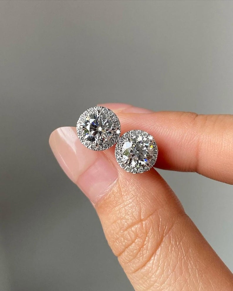 Certified 4 Carat Round Cut Lab Grown Diamond VVS1 D Color 14kt Solid White Gold Earrings: Certified 4 Carat Round Cut Lab Grown Diamond VVS1 D Color 14kt Solid White Gold Earrings - Side Stone is Lab Grwon Diamonds Round Cut VS1 E Color 0. 30 Ct …...
