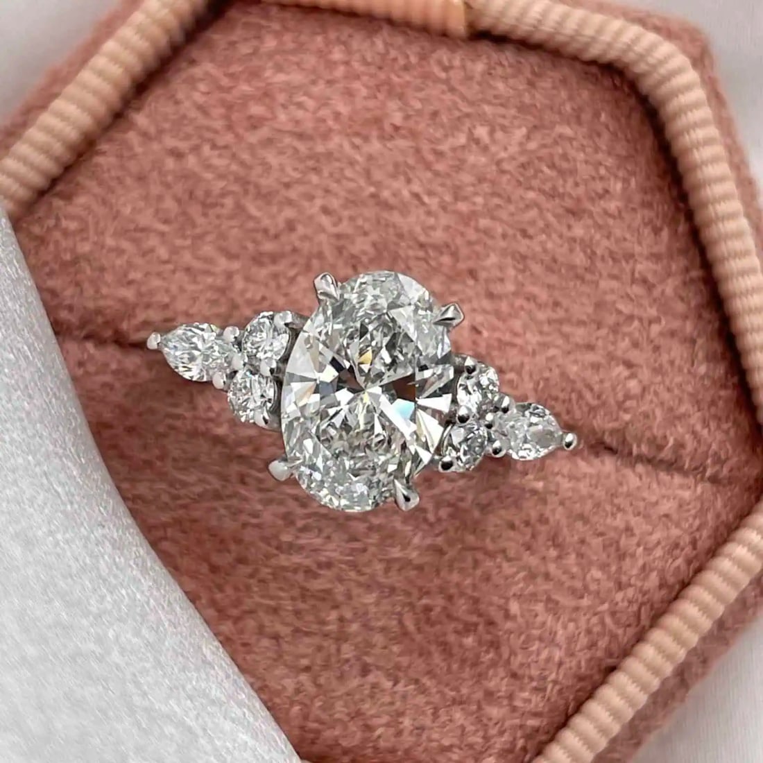 Certified 4.00 Carat Lab Grown Diamond 14kt Solid White Gold Engagement Ring: Certified 4.00 Carat Lab Grown Diamond 14kt Solid White Gold Engagement Ring - Oval cut vs1 d color - Side Stone is 0.60 ct vs1 e color round cut - Ring Size US 6.5 - Resize Available free of Cost - F