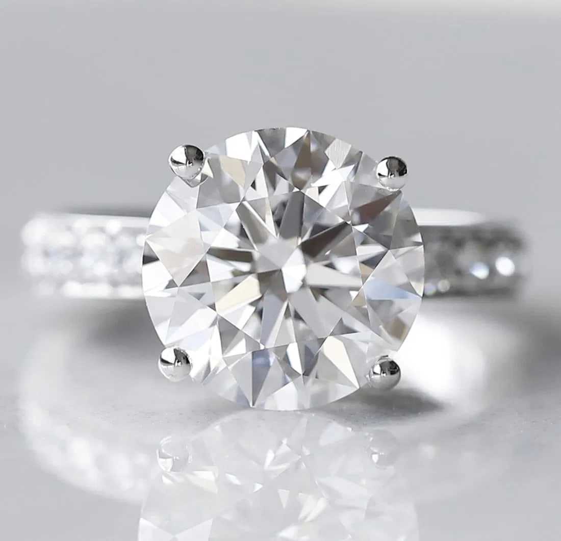 Certified 5 Carat Round Cut 18kt Solid White Gold Lab Grown Engagement Diamond Ring: Certified 5 Carat Round Cut 18kt Solid White Gold Lab Grown Engagement Diamond Ring E VVS1 - Ring Size US -7 -- Side Diamonds 0.80 Carat VVS1 H Color - Ring Resize Available free of Cost, - Free Shipp