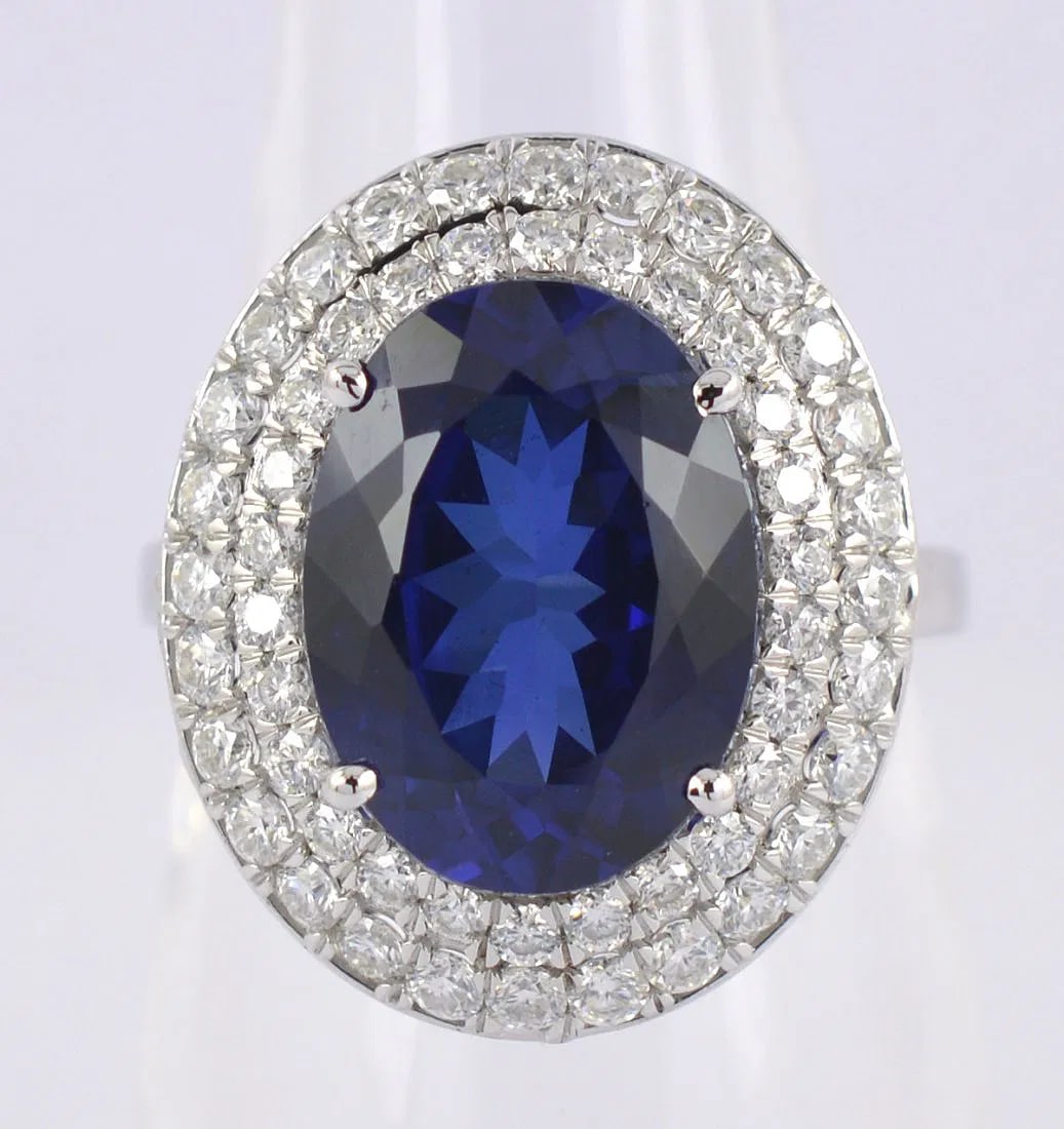 Certified 12 Carat Blue Sapphire Oval Cut 14kt Solid White Gold Ring: Certified 12 Carat Blue Sapphire Oval Cut 14kt Solid White Gold Ring Lab Grown Blue Sapphire Ring14Kt/58.3 Hallmarked White Gold Gross Metal Weight - 5.92 g Ring size - US 7 Color - Blue Cut -Oval Cut