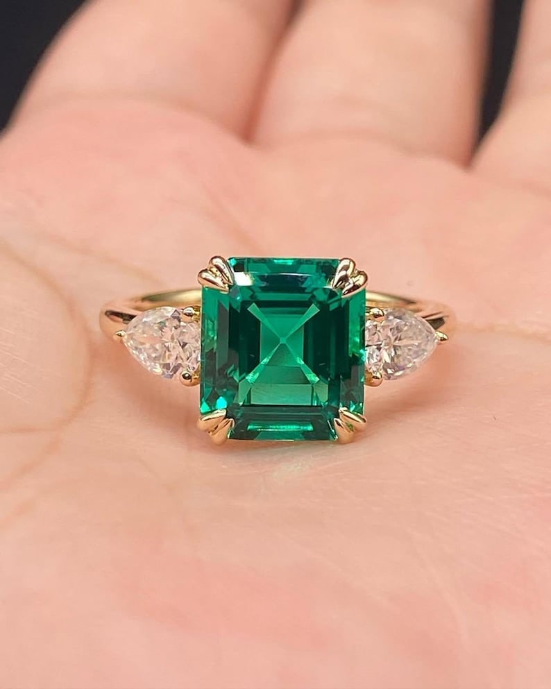 Certified 6.00 Carat Asscher Cut Lab Grown Emerald Engagement Ring in 14K Yellow Gold Three Stone: Certified 6.00 Carat Asscher Cut Lab Grown Emerald Engagement Ring in 14K Yellow Gold Three Stone Ring | Luxury Promise Ring |Side Stone Lab Grown Diamonds VVS1 D Color Pear Cut 1.00 ct - Ring Size US