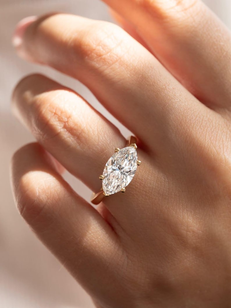 Certified 3.00 Carat Marquise Cut D VVS1 Lab Grown Diamond 14KT Yellow Gold Solitaire Ring: Certified 3.00 Carat Marquise Cut D VVS1 Lab Grown Diamond 14KT Yellow Gold Solitaire Ring Ring Size - 6
